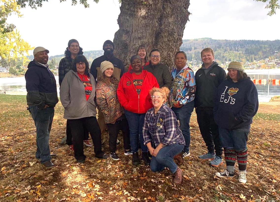 Group photo of RAP volunteers in front of a tree